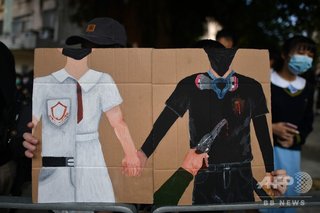 香港デモ、撃たれた高校生起訴 政府は「覆面禁止」へ